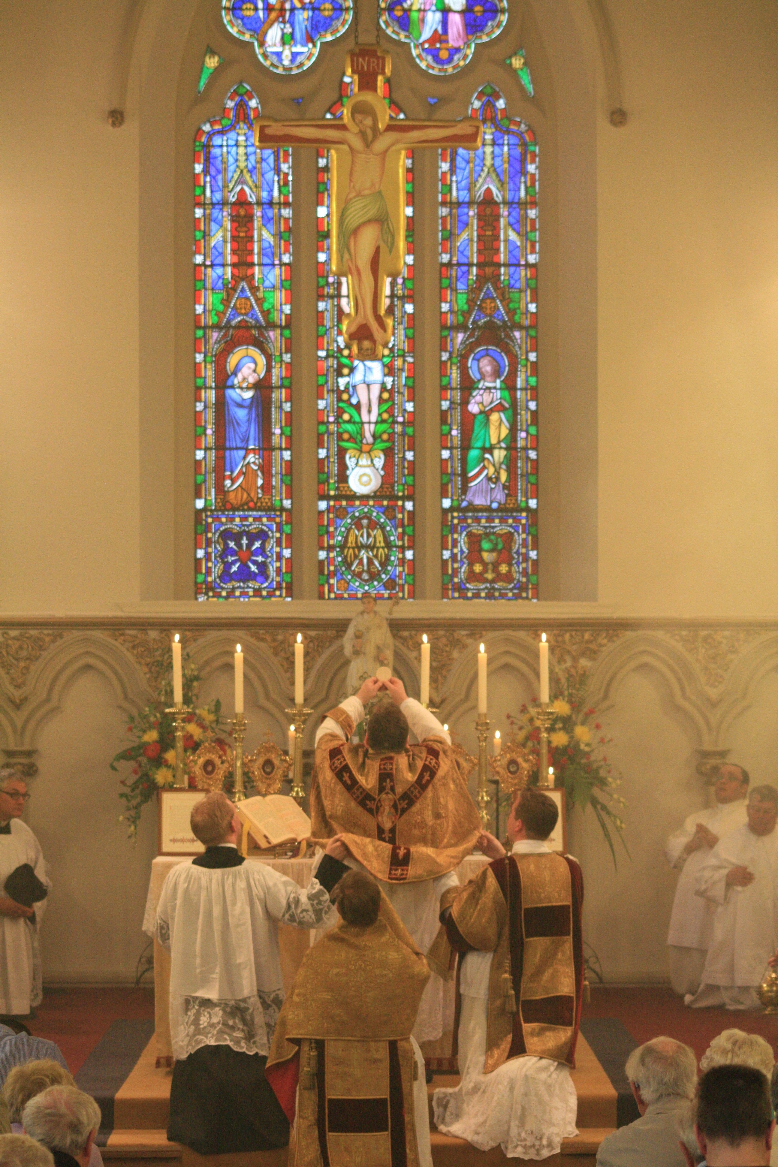 Lifting high the Blessed Sacrament above all the errors and miseries of the world.