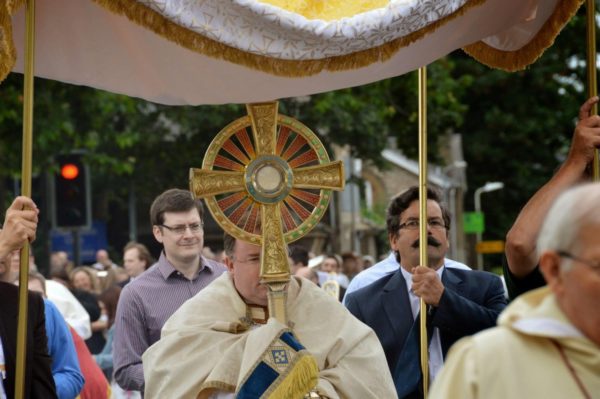 Abbot Hugh carries the Blessed Sacrament in Procession